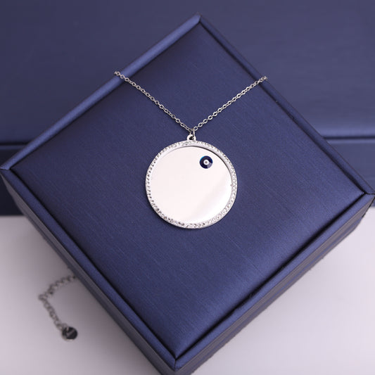 سنسال دائرة بإطار زركون – عين زرقاء 🔵✨