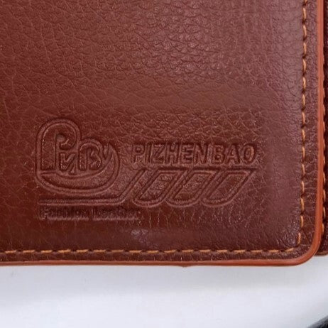 جزدان جلد طبيعي بلون عسلي – تصميم Pv.B الأنيق 🧡